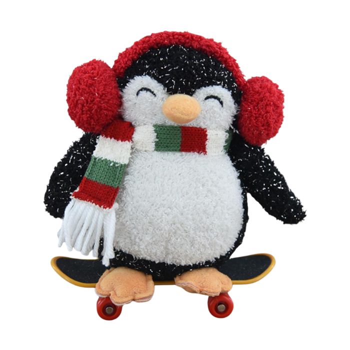 Peluche pingouin avec cache-oreilles et planche à roulette