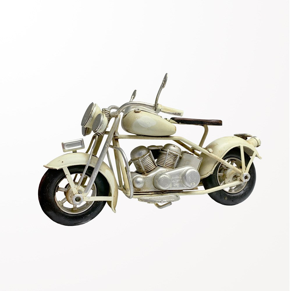Moto ancienne en métal blanc