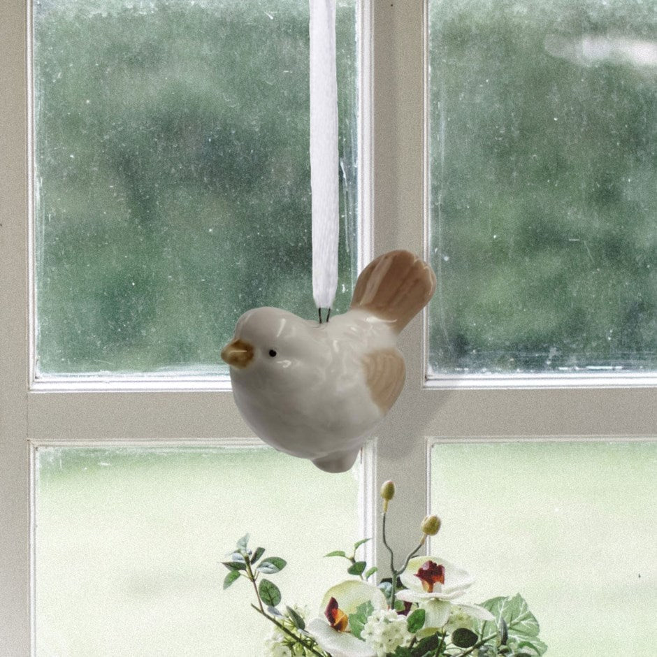 Ornement oiseau beige à suspendre