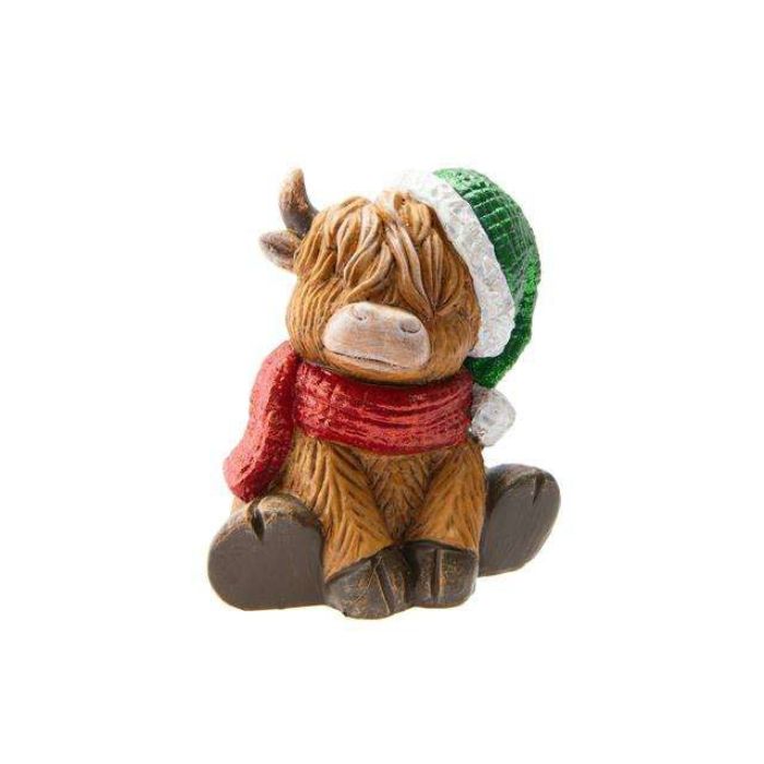 Vache highland assise 6,3 po x 4,75 po x 6,7 po avec tuque de Noël