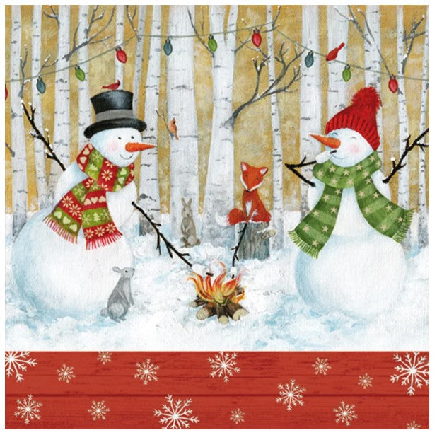 Serviette de table en papier 3 plis bonhomme de neige près du feu de camp (paquet de 20)