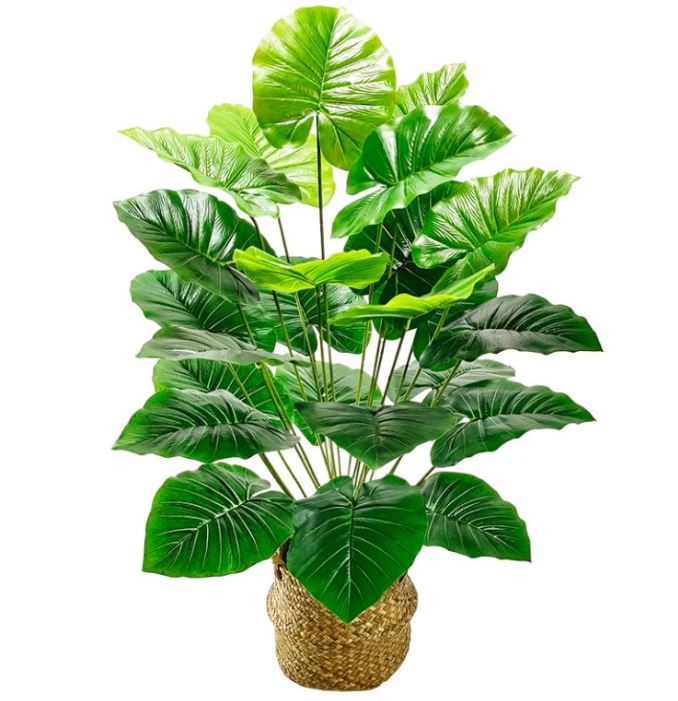 Plante verte artificielle dans un pot beige
