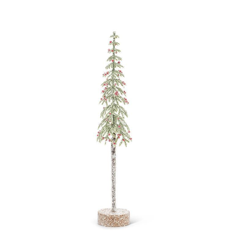 Sapin étroit enneigé avec baies rouges et base en bois