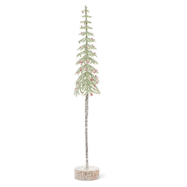 Sapin étroit enneigé avec baies rouges et base en bois