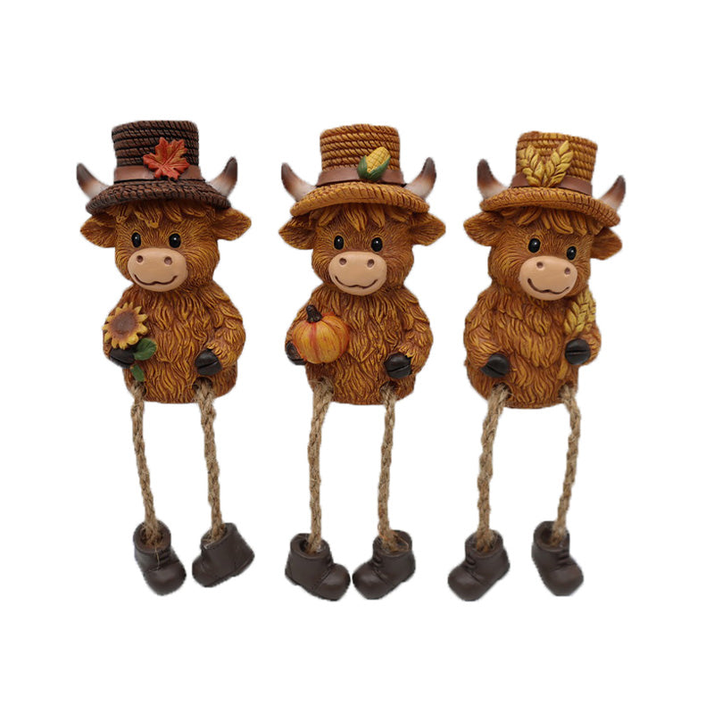 Vache en résine 4 po x 2,5 po avec pattes pendantes