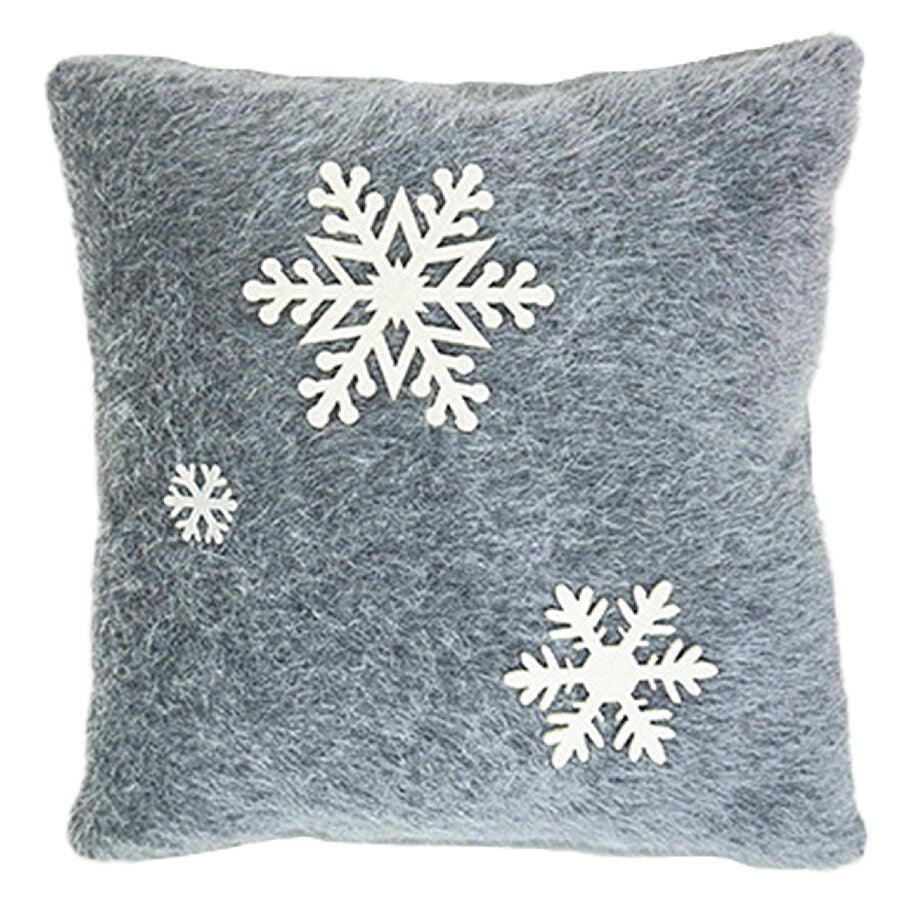 Coussin en fausse fourrure grise avec des flocons