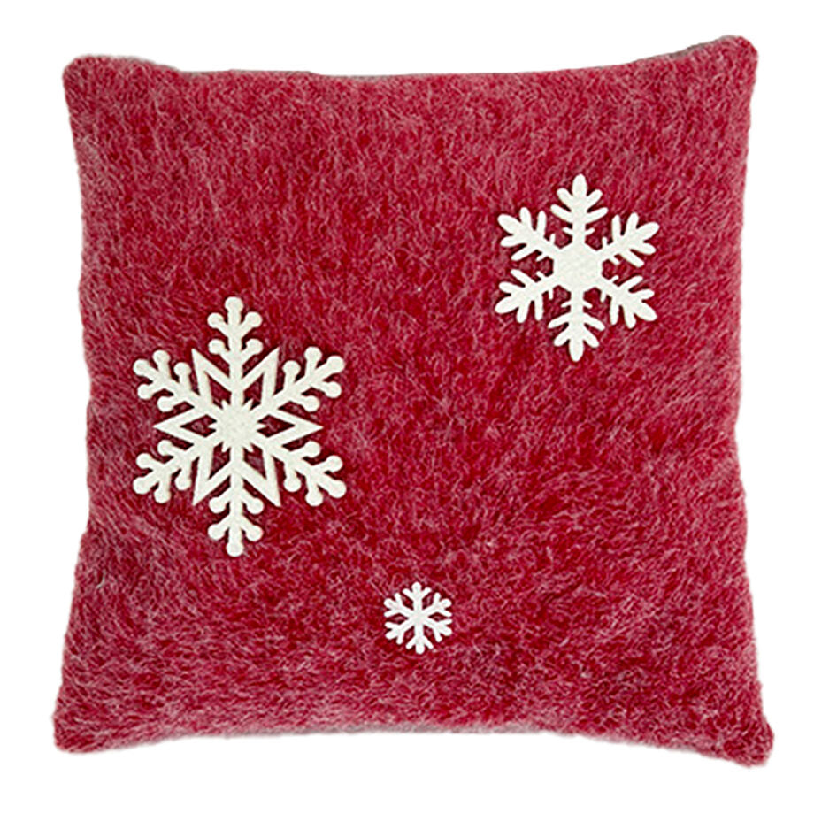 Coussin en fausse fourrure rouge avec des flocons